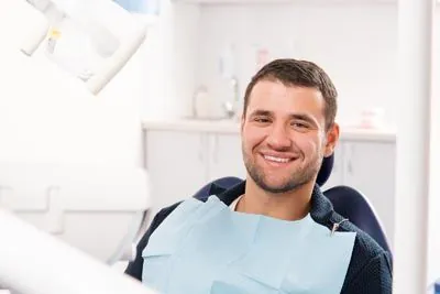 man sitting in the dental chair at Brite Dental Partners
