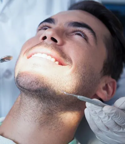 man smiling during his dental appointment at Brite Dental Partners