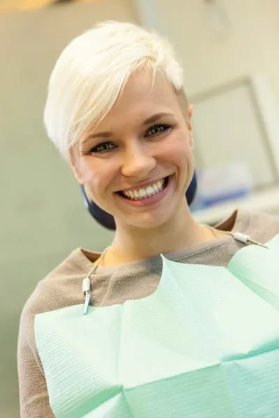 woman smiling during her dental appointment at Brite Dental Partners